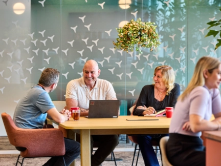 Three colleagues meeting